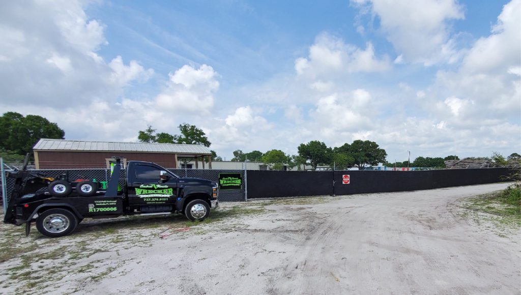 Central Florida Wrecker Service LLC tow truck outside in their warehouse