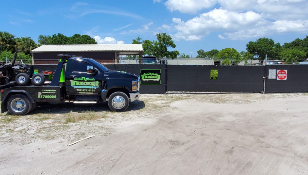 Central Florida Wrecker Service LLC tow truck outside in their warehouse