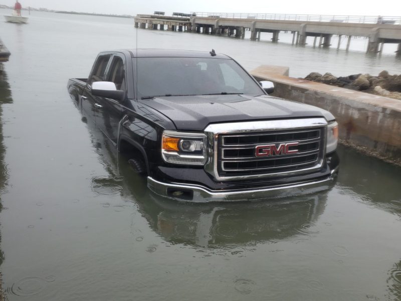 GMC brand car in the fell in the water